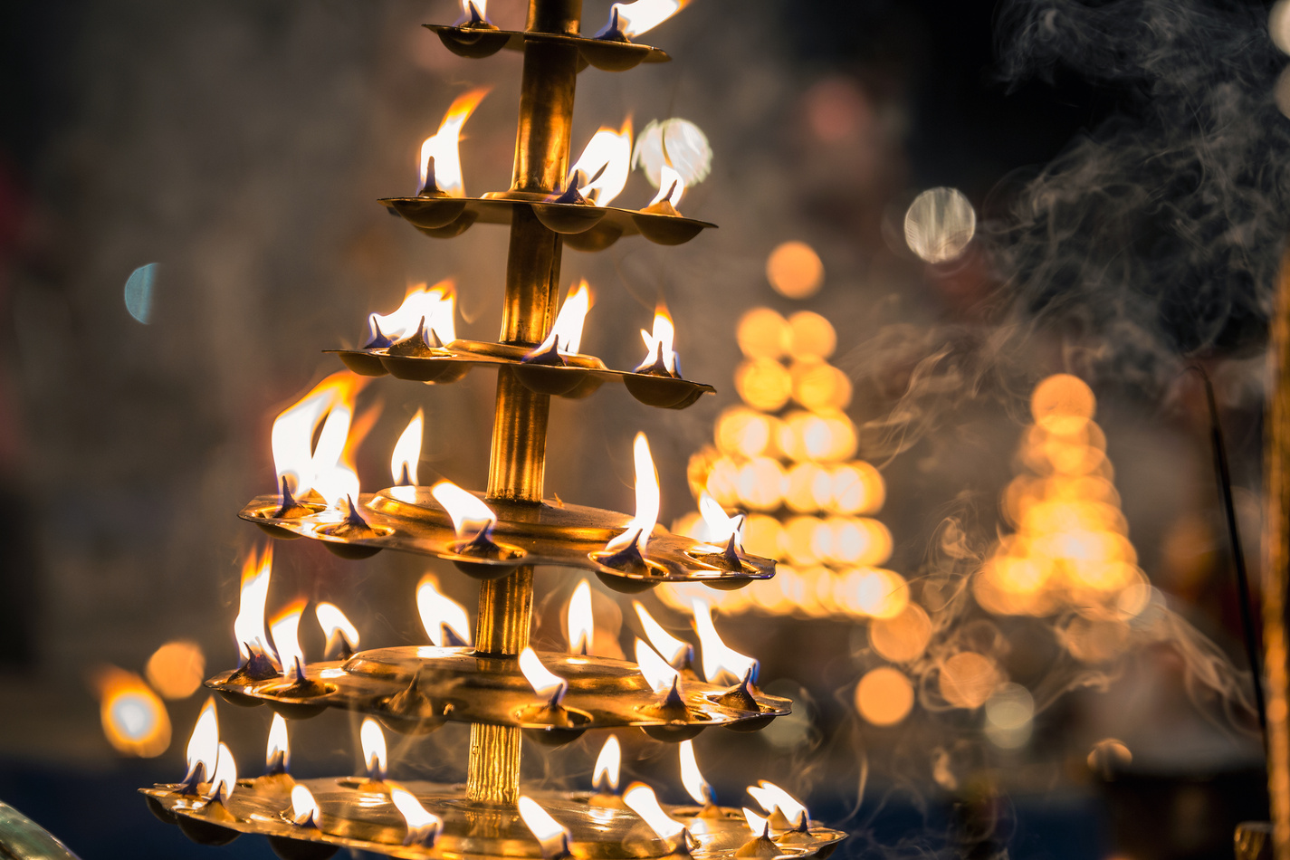 Candles used in performance of religious Ganga Aarti ritual fire puja at Dashashwamedh Ghat in Varanasi, Uttar Pradesh, India.